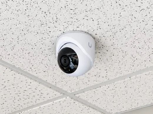 Dome security camera mounted in an office ceiling